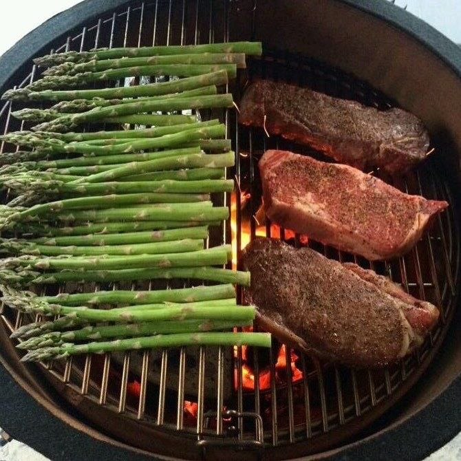 Outdoor Kamado grill in a bustling restaurant kitchen